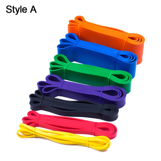 Set of colorful resistance bands on a white background